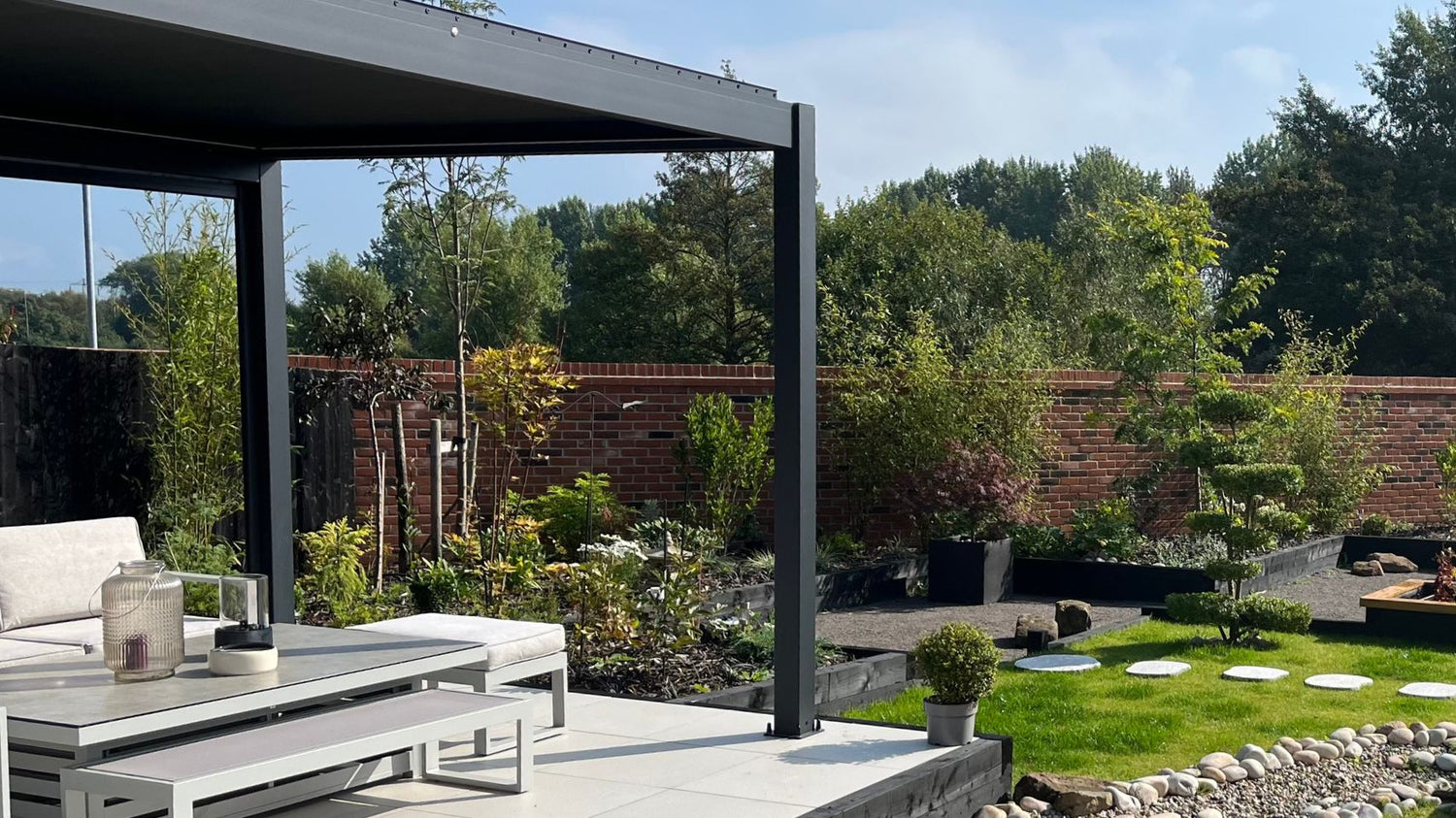 aluminium pergola in a sunny garden