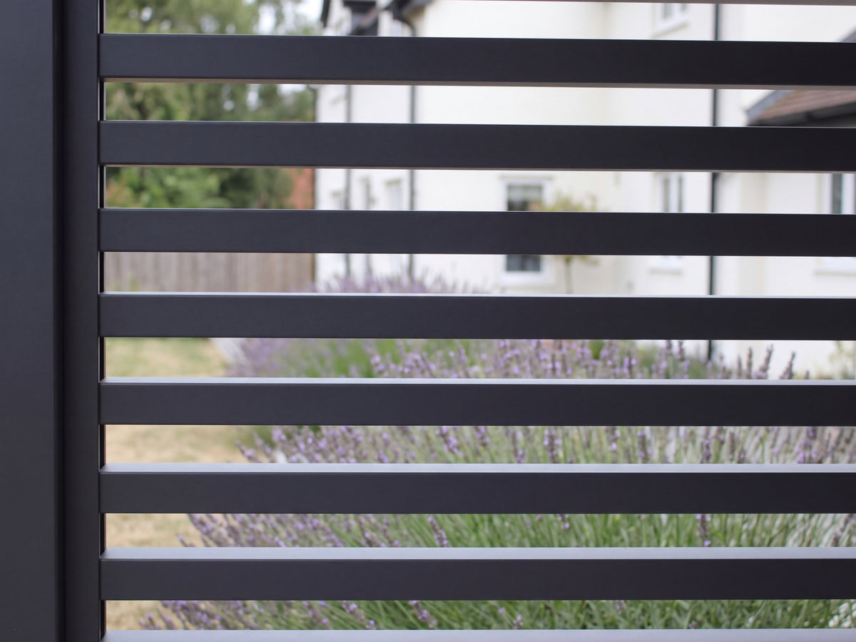 LuxSol Aura 3x4 · Slatted-wall detail · square profiles and clear gaps · different British cottage garden · Furniture and optional accessories shown for styling