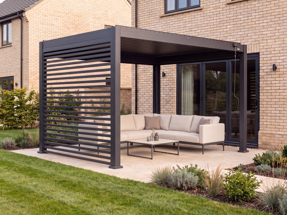 LuxSol Aura 3x4 · Slatted-wall luxury lounge · Left slatted wall, closed roof and screens raised · Cream upholstered outdoor seating and ceramic coffee table · Furniture and optional accessories shown for styling