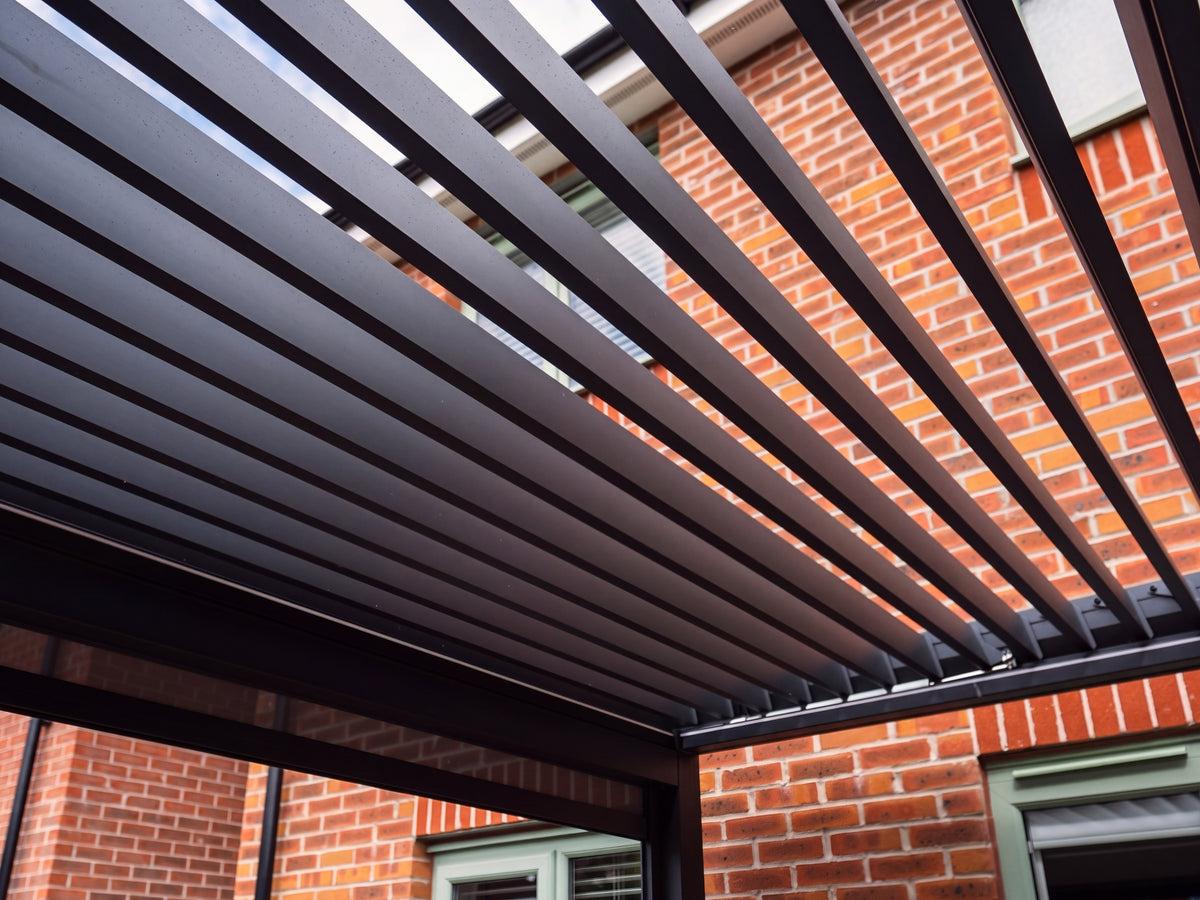 Close-up of the Como open louvres and roof corner connection in daylight.