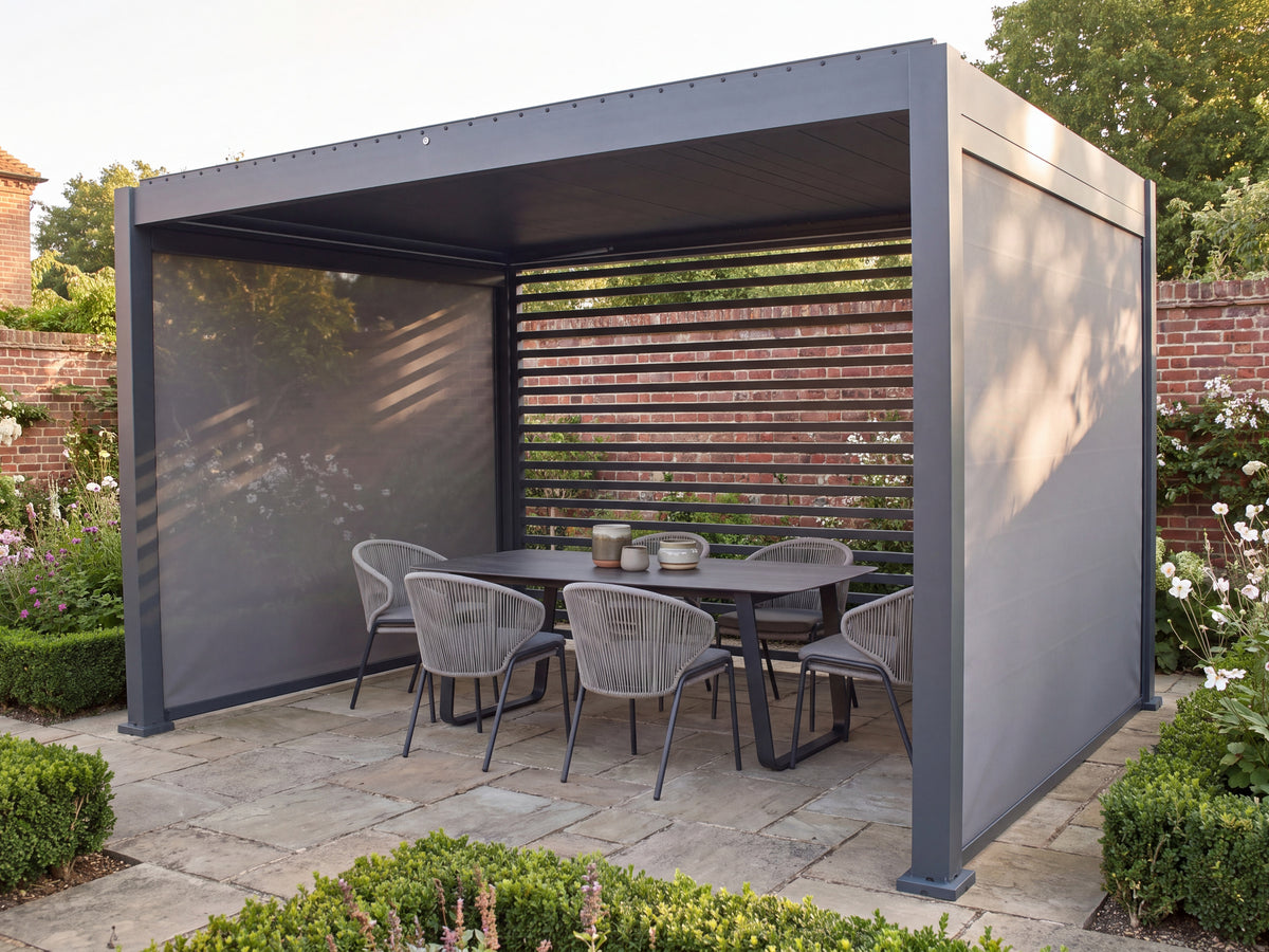 Como pergola with lowered side screens, a rear slatted wall and an outdoor dining set in a walled garden.