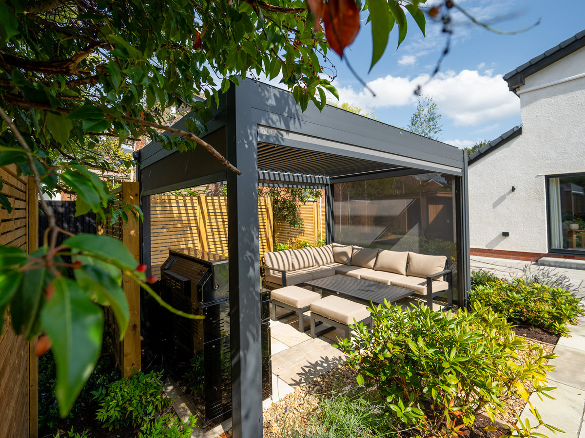 Como pergola over a furnished garden lounge