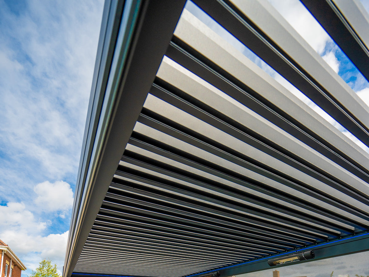 Open the roof to the sky. Real Tora installation with electric louvres; optional screens and heaters shown.