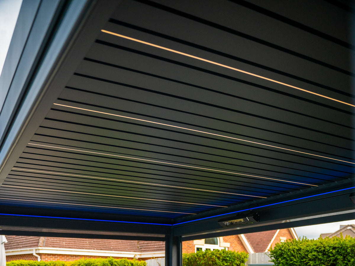 White louvre lighting. Colour around the perimeter. Real Tora installation; optional screens and heaters shown.