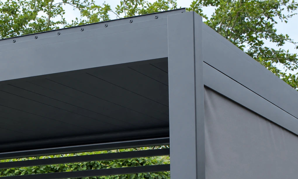 Close-up of a Como aluminium post and beam corner with a smooth satin finish