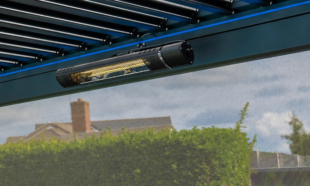 Infrared heater mounted beneath a Tora pergola beam beside a privacy screen