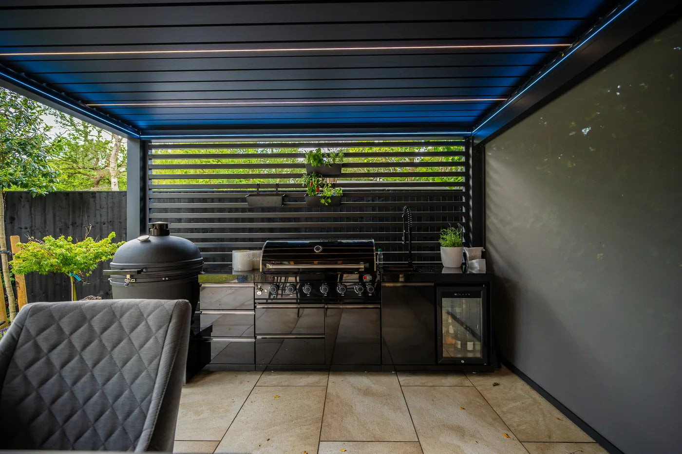 Real Tora installation showing blue integrated lighting beneath the louvred roof