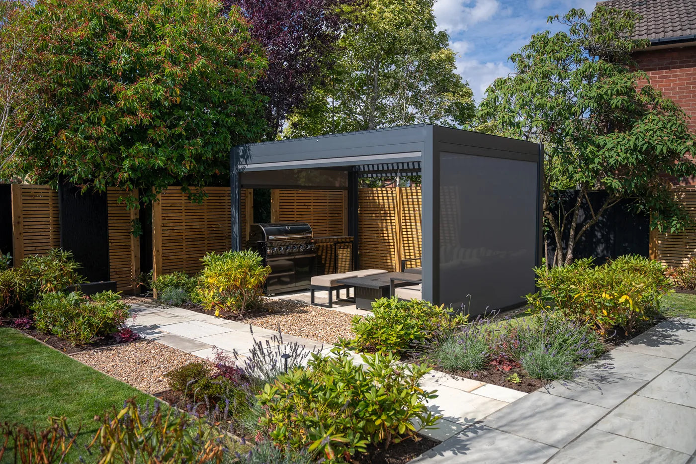 Como pergola with a side screen creating a private garden seating area