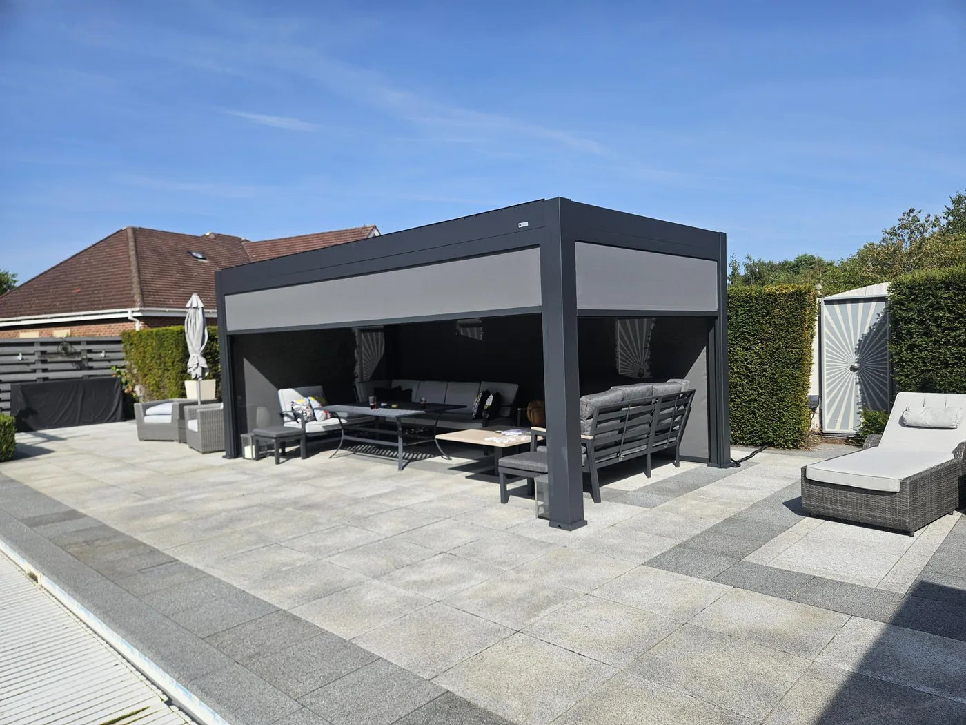 Tora pergola with garden seating and side walls