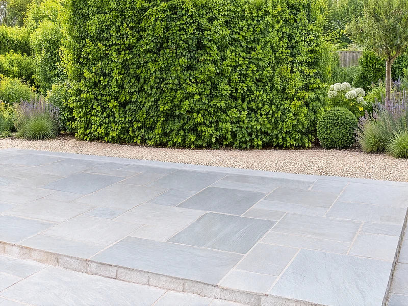 Clear grey stone patio before the pergola is installed
